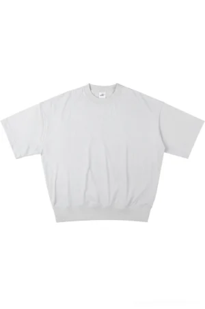 Light gray oversized relaxed fit sweater tee with dropped shoulders and ribbed crew neck on a white studio background