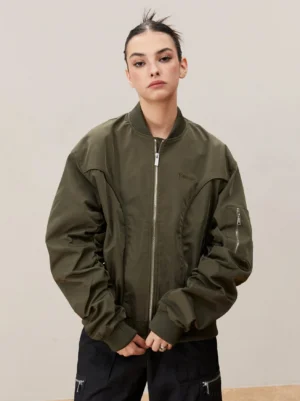 Army green oversized ribbed MA-1 bomber jacket with utility sleeve zip pocket shown on female model