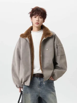 Gray sherpa-lined aviator bomber jacket with relaxed oversized fit styled with a white tee and blue jeans