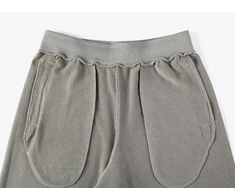 Side pocket detail oversized drawstring sweat shorts functional slip pocket seamless design integration streetwear casual wear