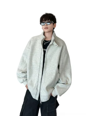 Heather gray oversized stand collar zip jacket worn by male model with black cargo pants in a Korean streetwear studio outfit