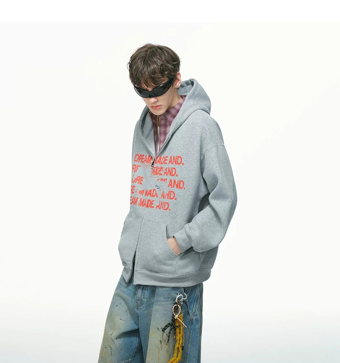 Heather grey oversized statement graphic zip-up hoodie styled with sunglasses and vintage baggy jeans