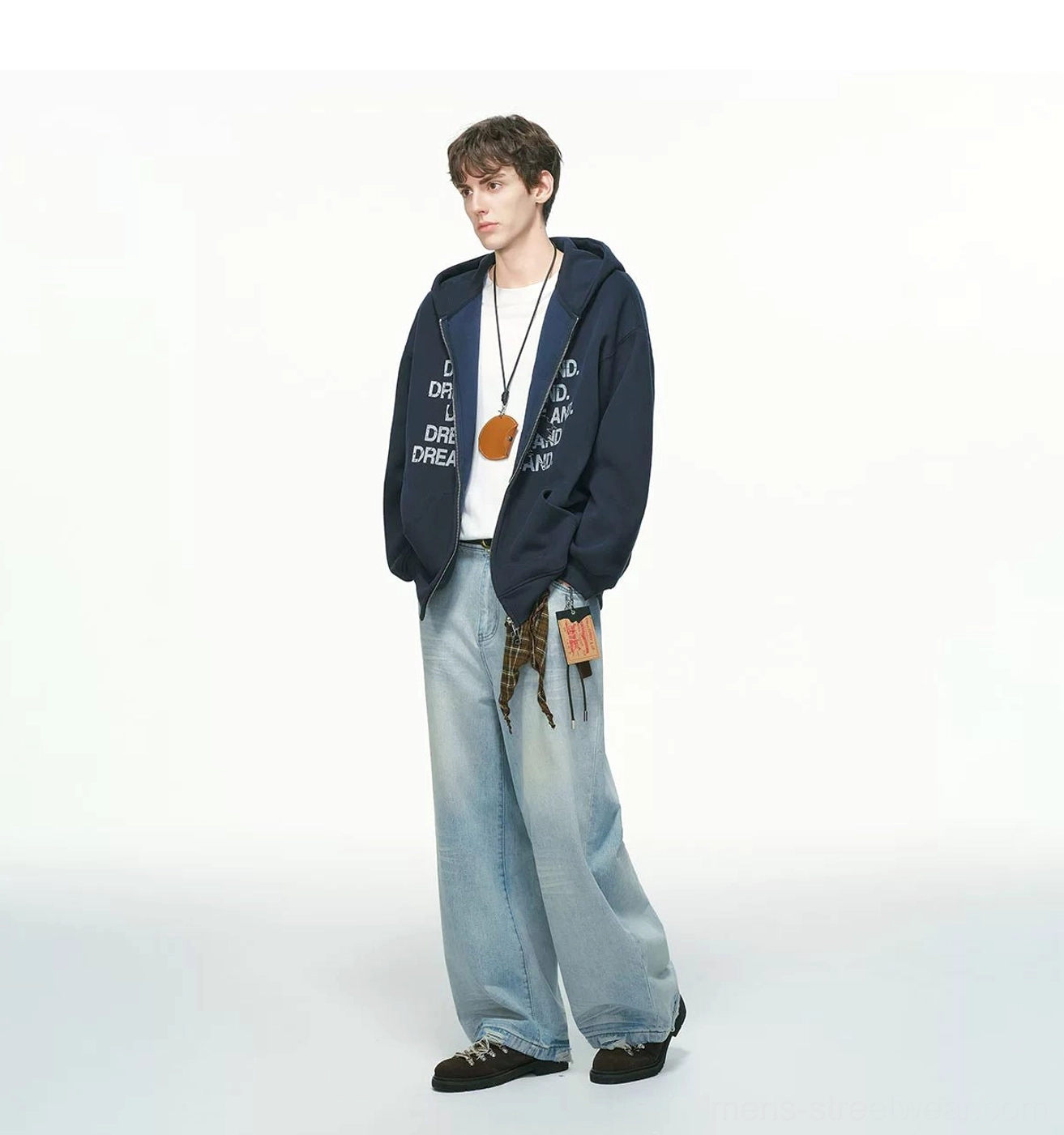 Navy blue statement graphic zip-up hoodie left side view styled with wide-leg light wash jeans