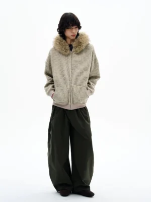 Light beige Khaki oversized striped faux fur collar zip hoodie worn by a male model in a minimalist studio