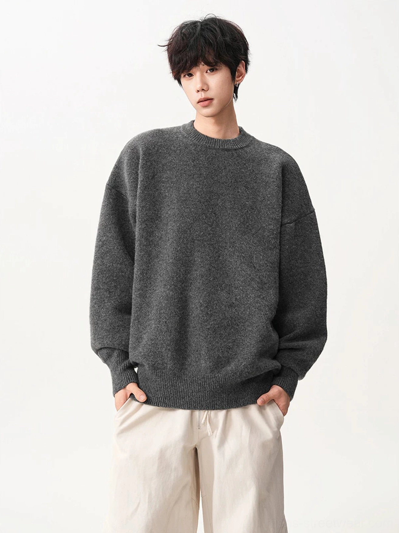 Heather gray oversized crew neck knit sweater with fuzzy textured fabric, dropped shoulders, and ribbed cuffs and hem shown in a front full-body streetwear outfit