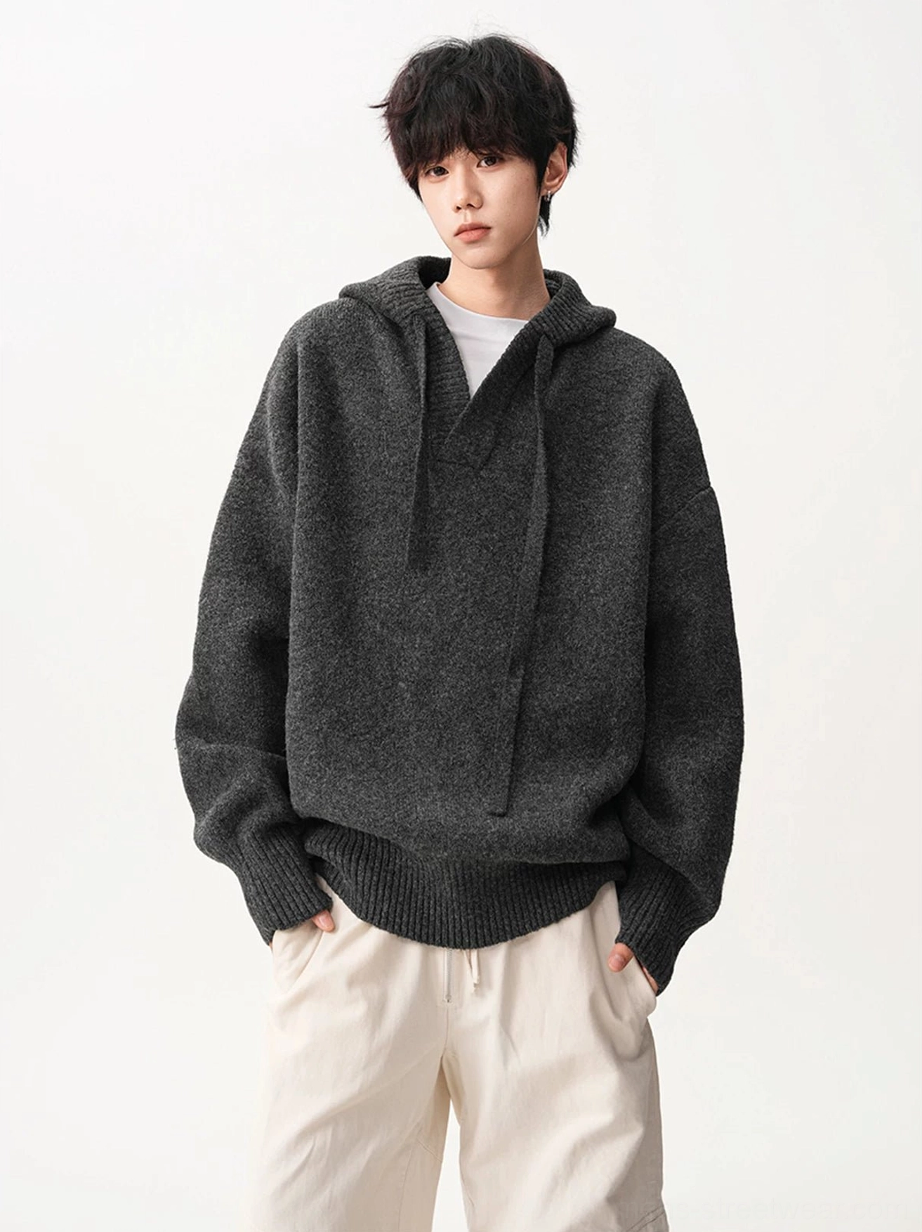 Dark gray oversized V-neck knit hoodie with drawstring hood and relaxed Korean streetwear silhouette front view