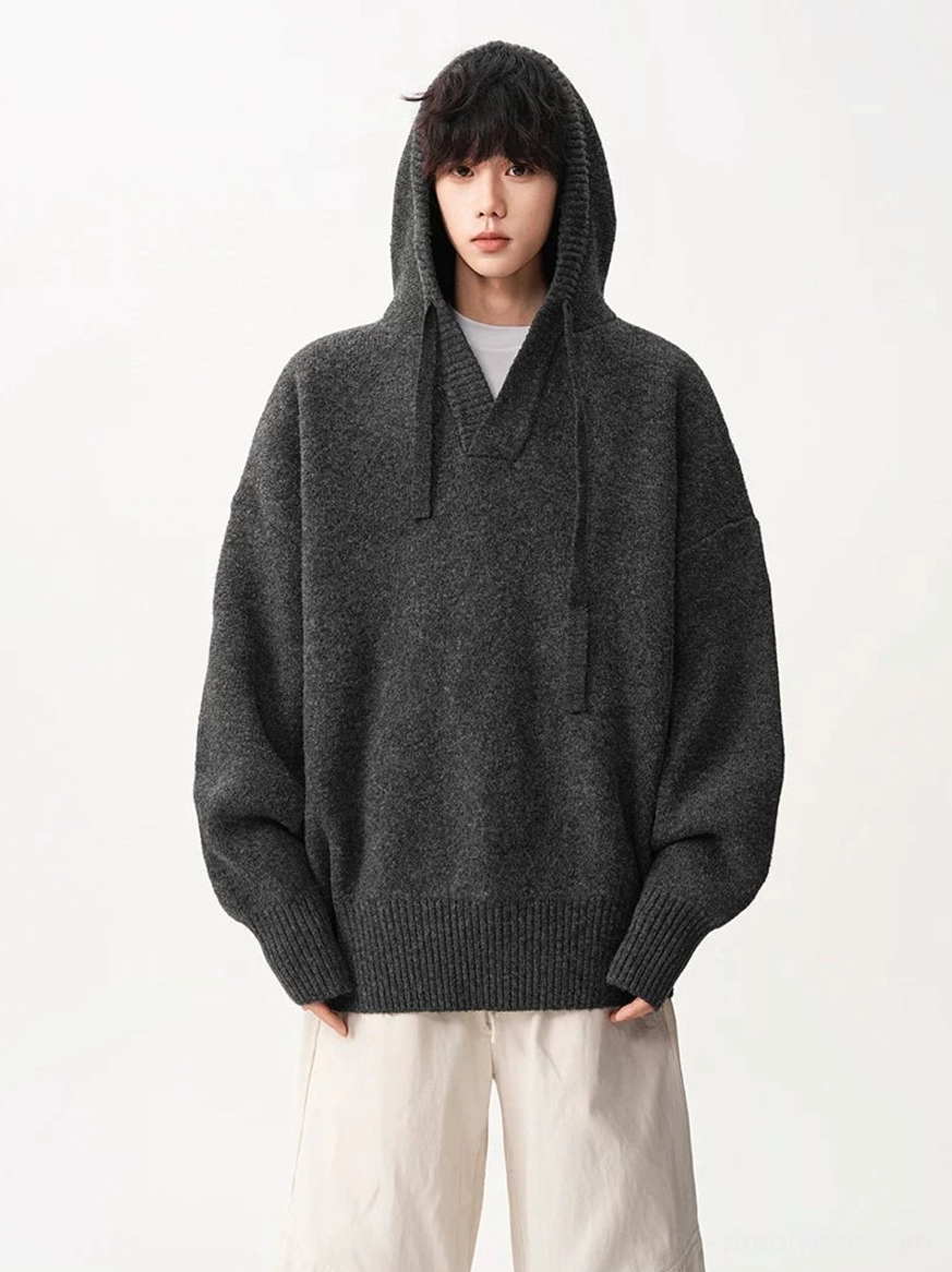 Oversized V-neck knit hoodie with drawstring hood and relaxed drop shoulder construction