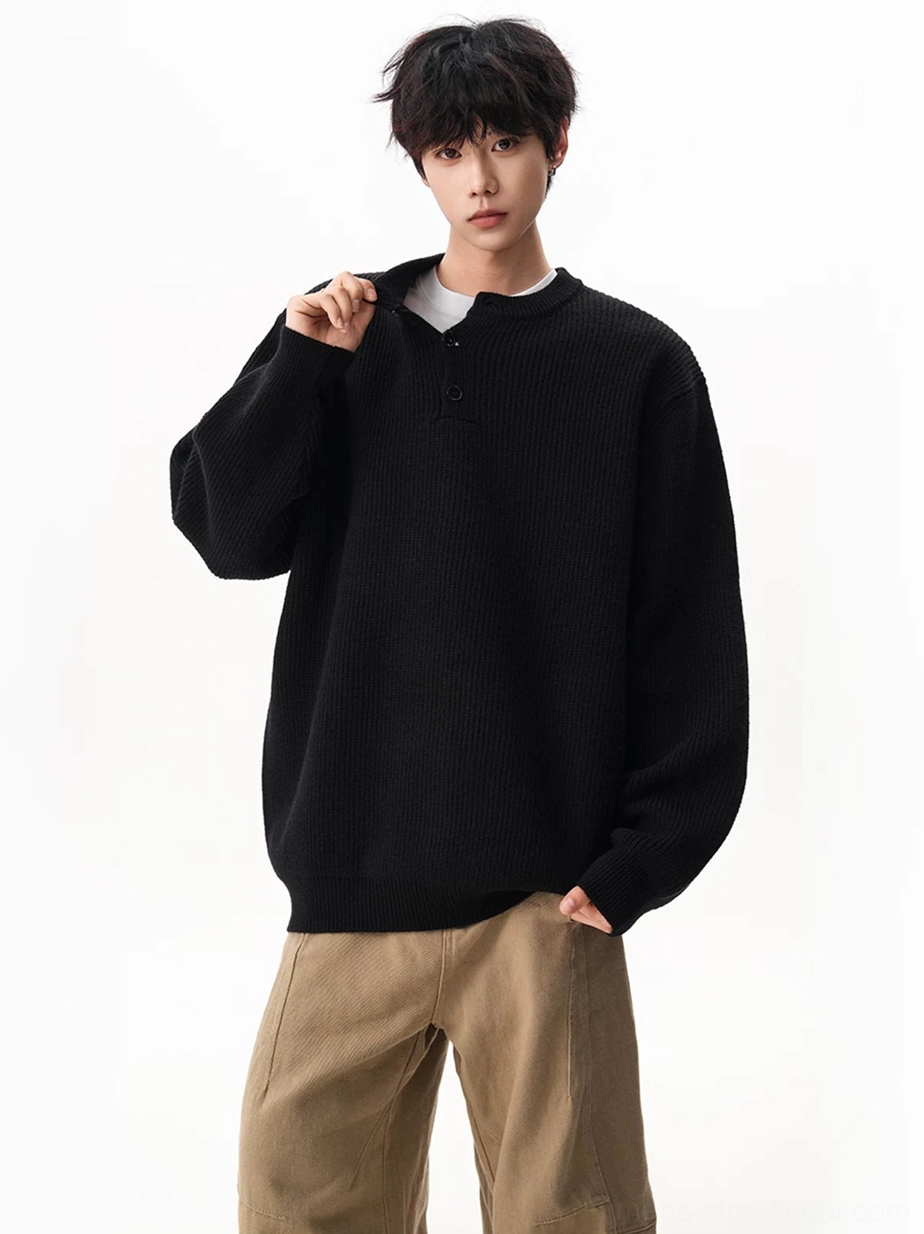 Front view of an oversized waffle Henley knit sweater with a button placket, ribbed texture, and relaxed drop shoulder Korean streetwear fit