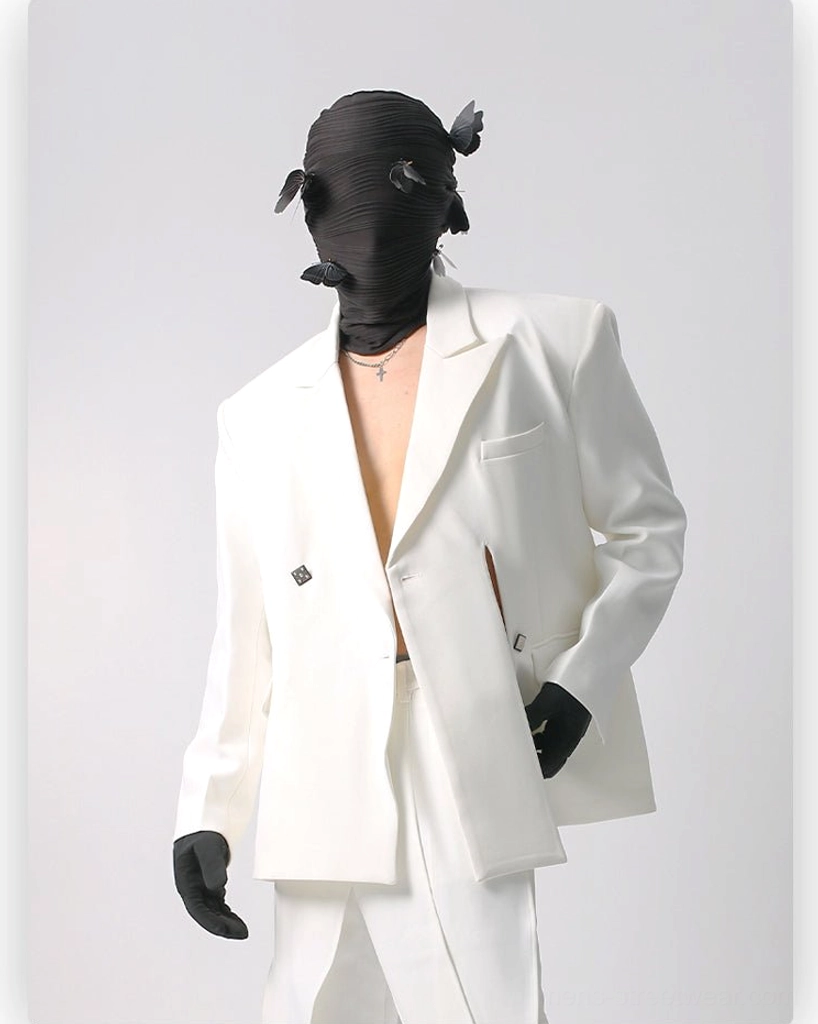 Oversized white double-breasted suit set with structured shoulders, smooth matte fabric, side-slit blazer hem, chest welt pocket, and wide-leg trousers