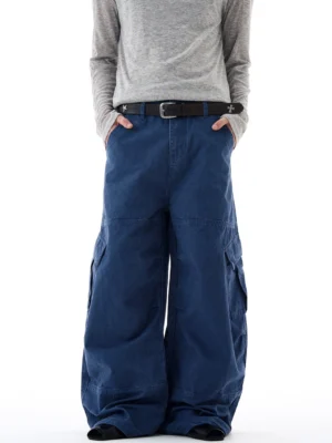 Navy blue oversized wide-leg cargo pants shown from the front with side flap pockets, soft cotton texture, and relaxed Korean streetwear styling