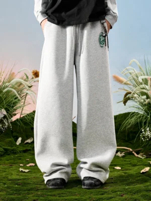 Heather gray oversized wide-leg drawstring sweatpants shown from a low front angle in a relaxed Korean streetwear outfit