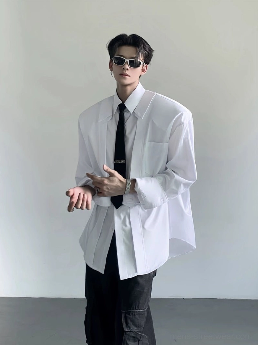 White oversized Korean streetwear dress shirt with wide shoulders chest pocket and split cuffs paired with black cargo pants