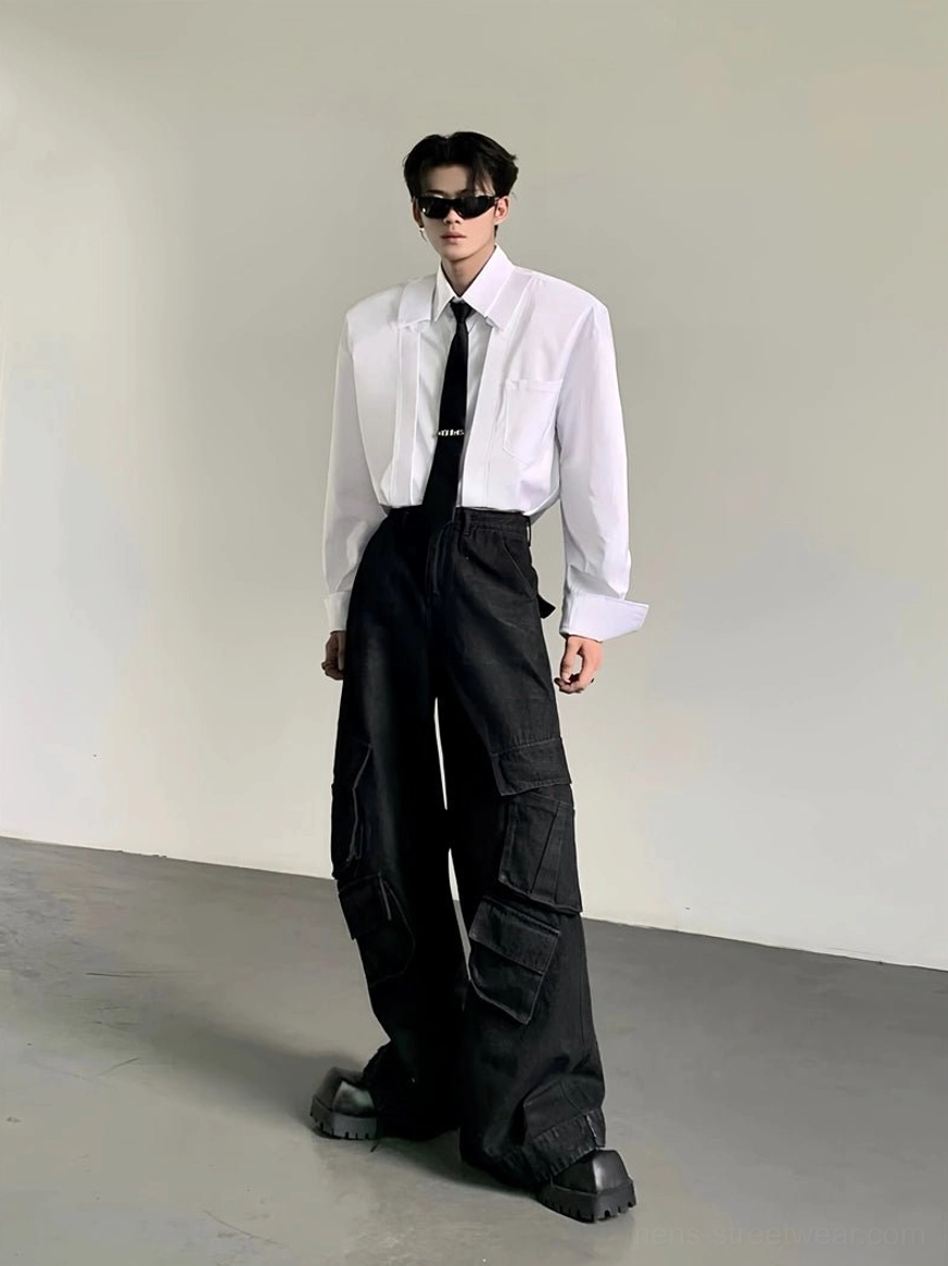 Full body view of white oversized wide-shoulder Korean streetwear dress shirt with long relaxed silhouette and black cargo pants