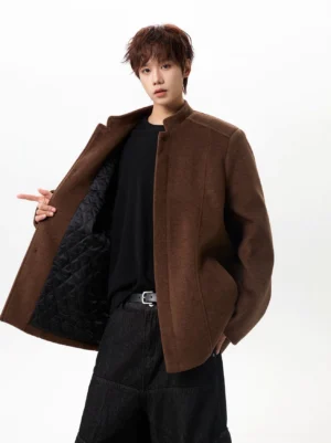 Brown oversized wool-look stand collar jacket with quilted lining shown in a three-quarter studio view