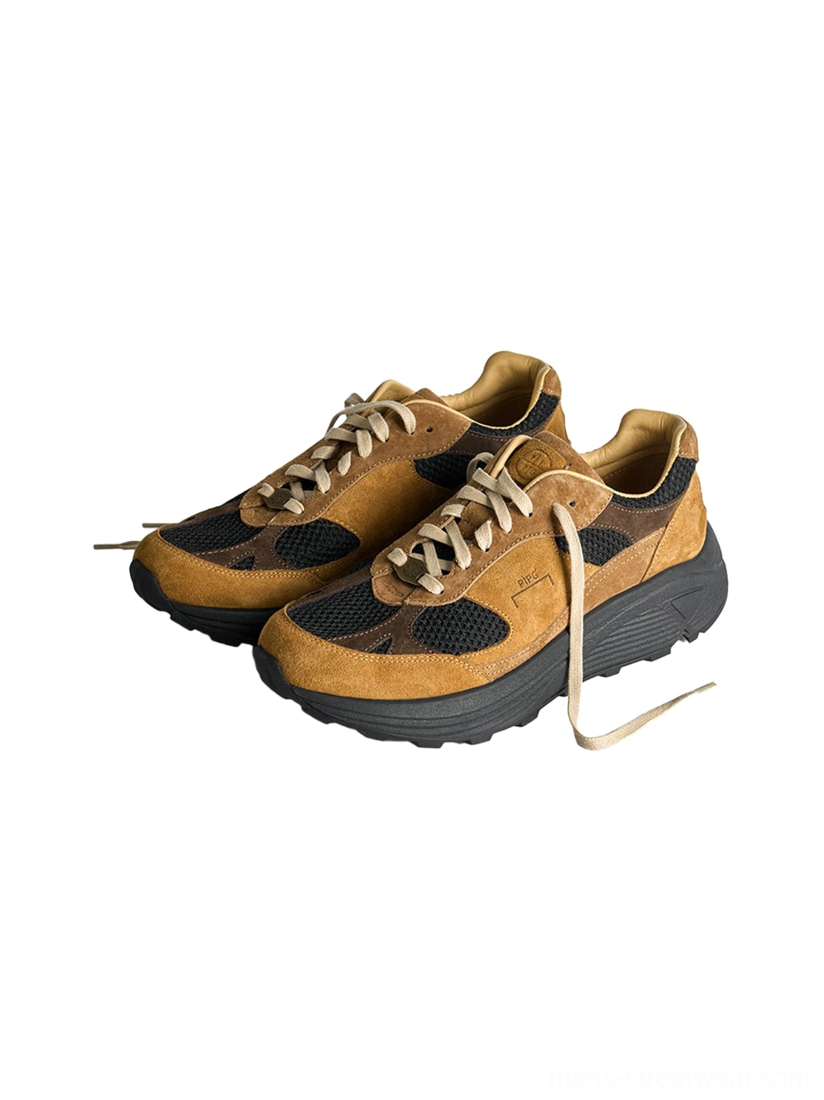 Pair of matching brown distressed suede trail runner sneakers displayed from above with cream laces and black soles