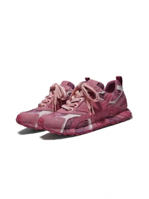 Pair of matching burgundy urban camo runner sneakers shown from the front three-quarter view with textured camouflage fabric and coordinated laces