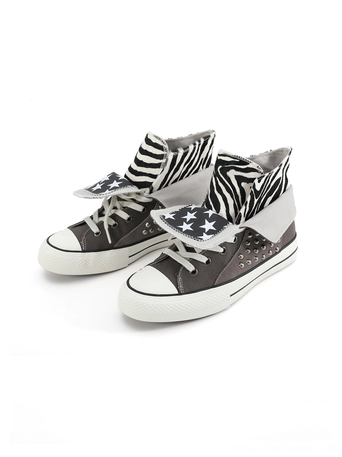 Pair of gray zebra studded canvas high-top sneakers shown from the front with lace-up design, silver side studs, and foldable collars