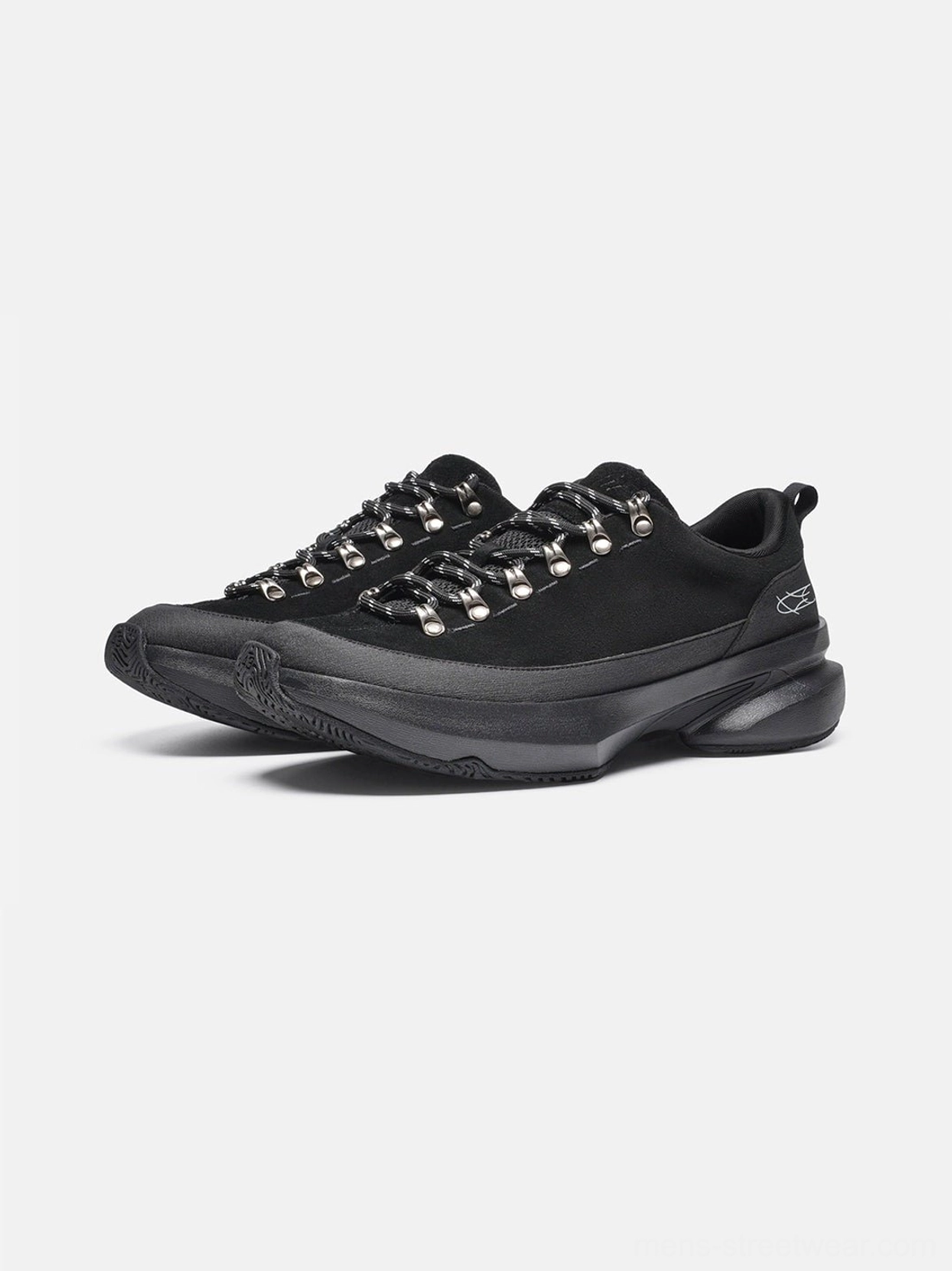 Pair of all-black samurai-inspired streetwear sneakers shown from the front three-quarter angle with tonal matte finish, metal lace hooks, and sculpted chunky soles