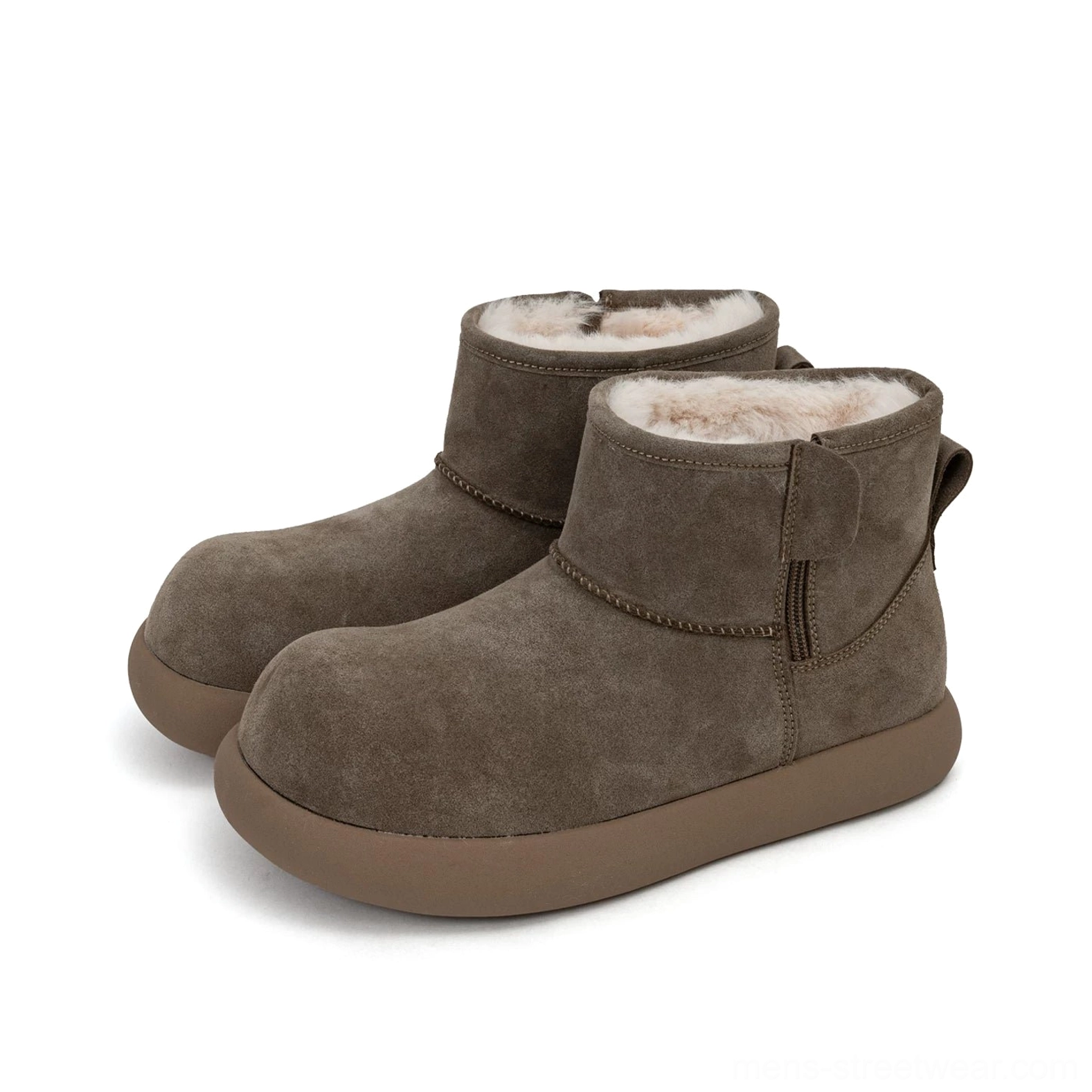 Pair of taupe suede shearling ankle boots on a white studio background, showing the fluffy fleece lining, side strap, rounded toe, and thick rubber outsole