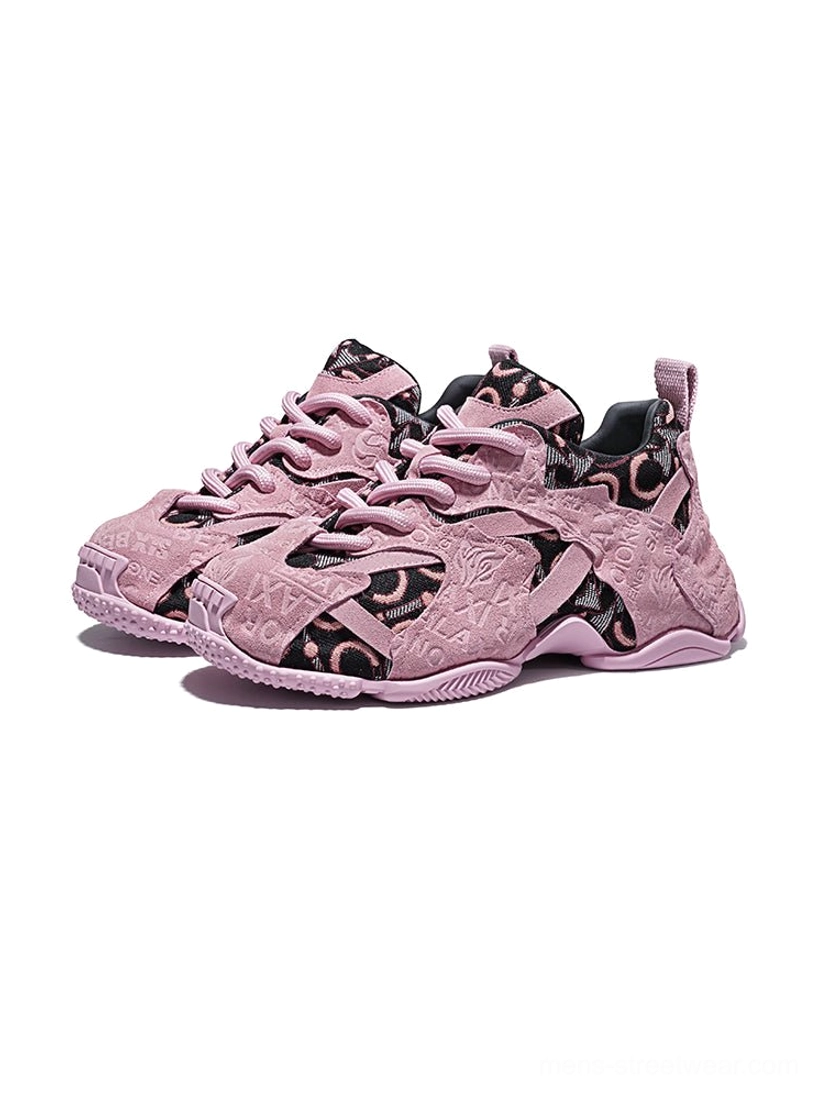 Pair of pink embroidered chunky dad sneakers displayed from the side with matching suede overlays, jacquard panels, and thick athletic soles