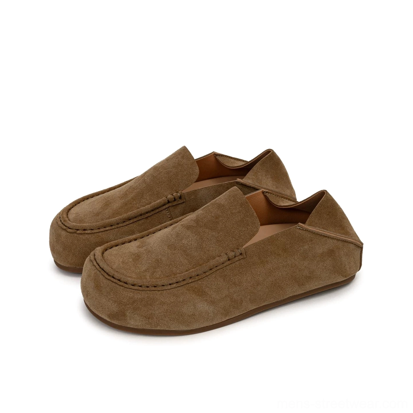 Pair of tan suede loafers displayed from an angled side view with rounded moc toe and decorative topstitching