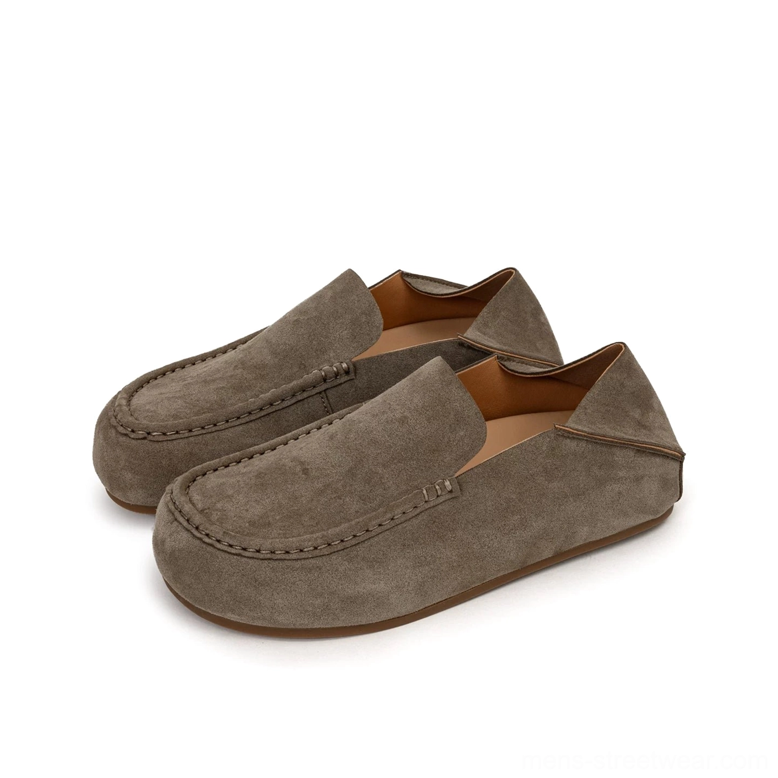 Pair of taupe suede loafers with foldable heel, grey brown finish, rounded moc toe, and neat decorative stitching