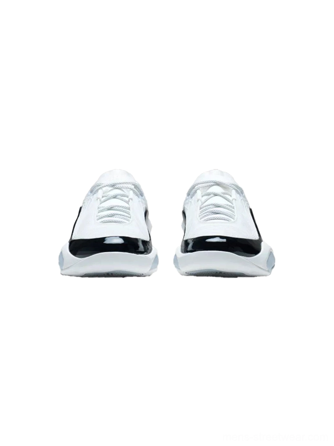 Pair of white leather basketball sneakers shown from the front with black patent-style toe caps and lace-up uppers