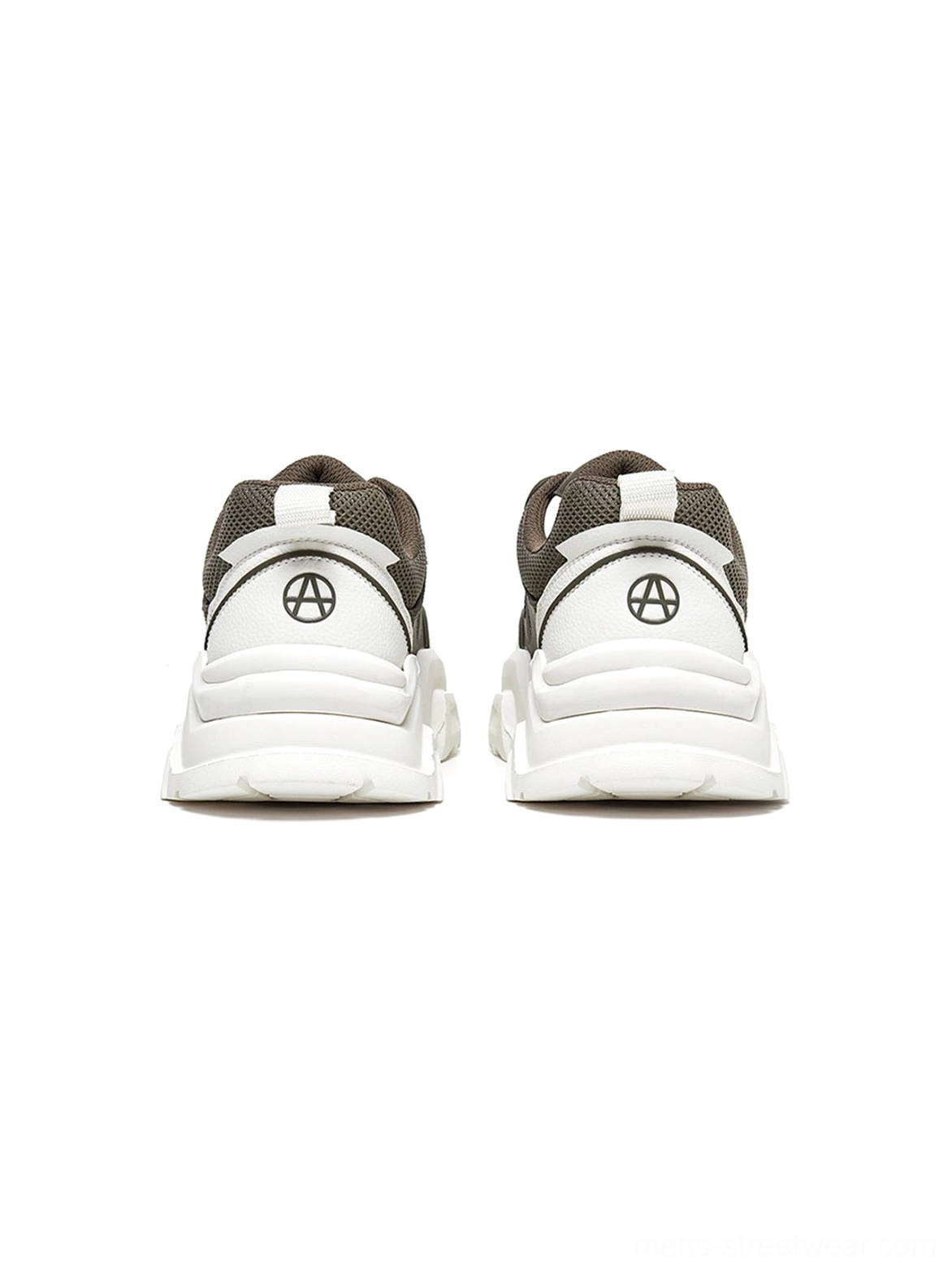 Paired black and white platform sneakers dynamic angled arrangement showcasing product depth three-dimensional architectural design elements