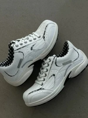 Paired white retro runner sneakers viewed from above with laces, breathable perforated panels, and visible checkered collar lining