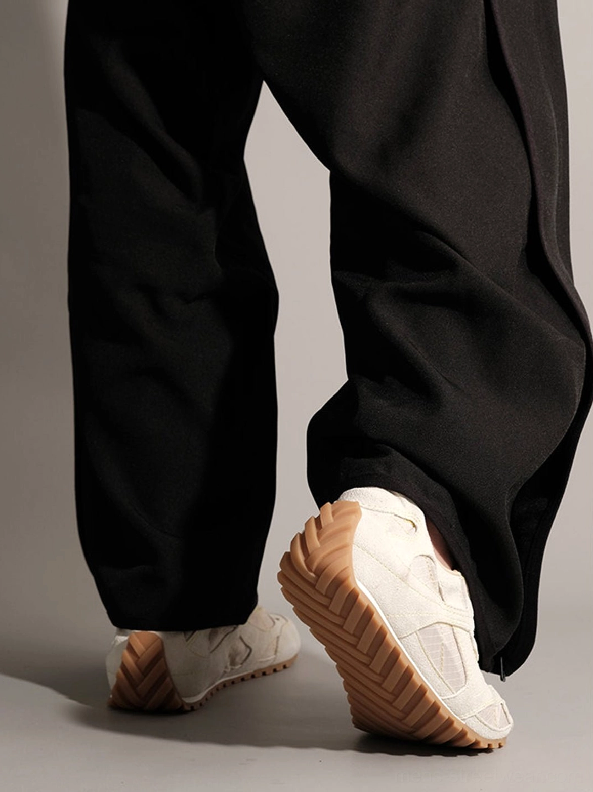 Paneled nubuck low-profile trainers with layered upper construction, lace-up closure, and gum rubber outsole