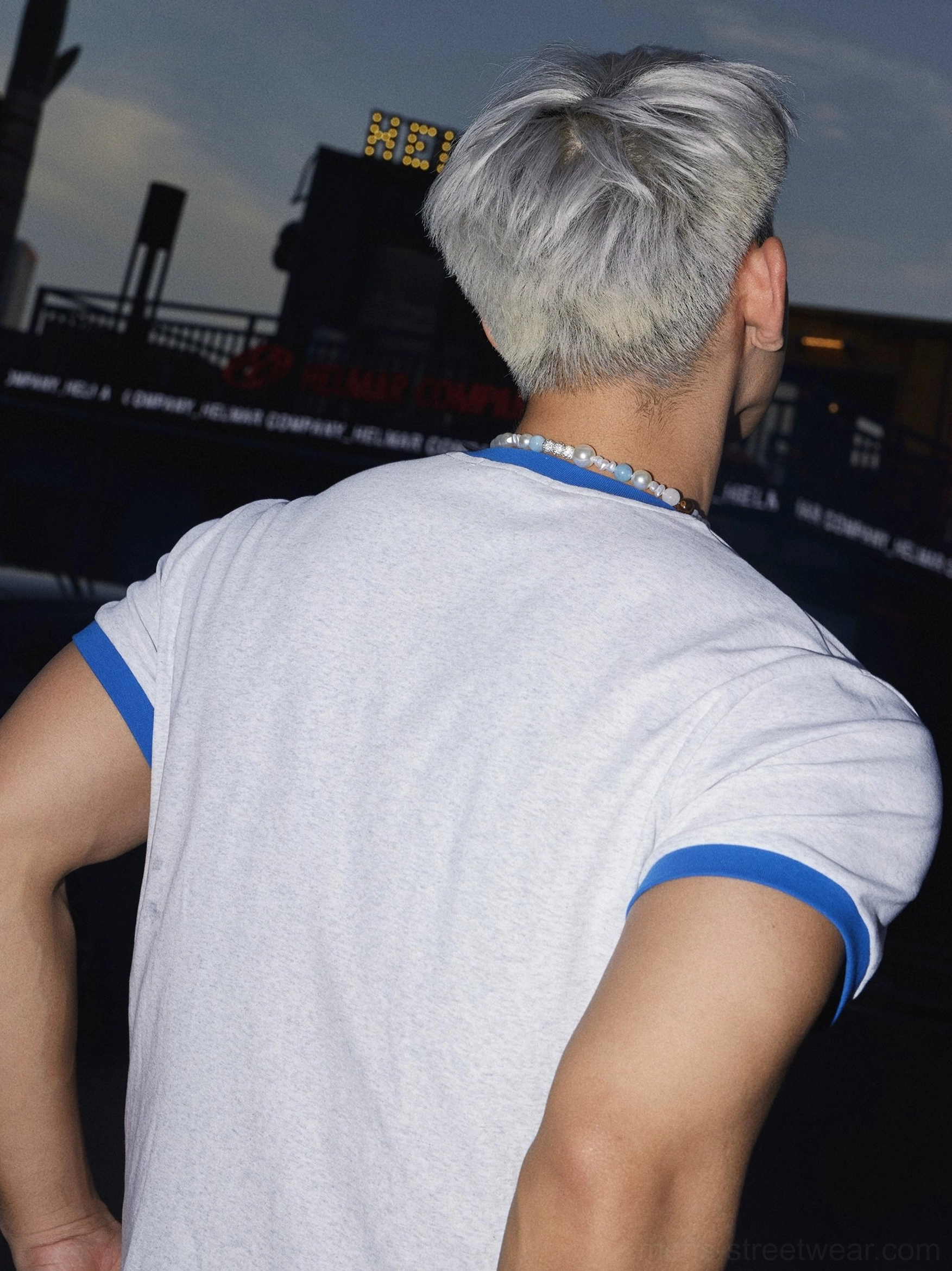 Back view of the light grey Papa's Lil Monster ringer T-shirt showing the clean heather grey back and blue contrast sleeve cuffs