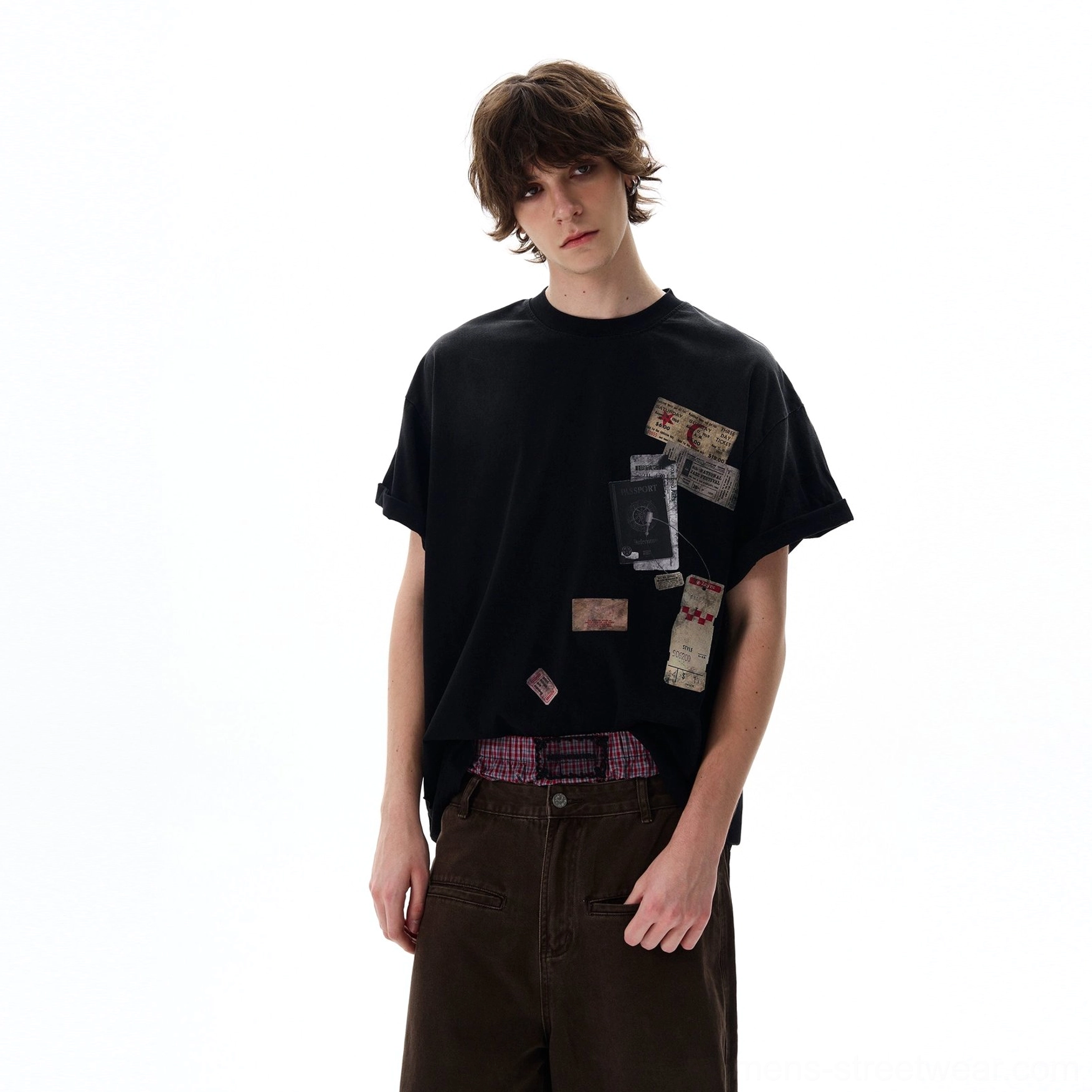 Passport stamp travel graphic oversized tee highlighting the washed cotton texture and relaxed urban streetwear silhouette
