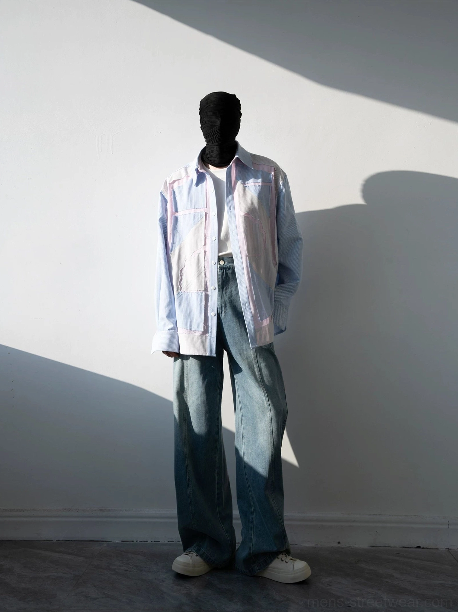 Pastel blue geometric patchwork long-sleeve button-up shirt styled with denim and white sneakers