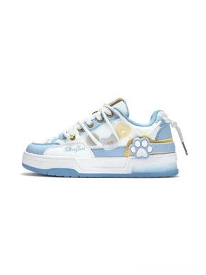 Pale blue and white paw print low-top court sneaker with layered panels, gold trim, and flat rubber outsole