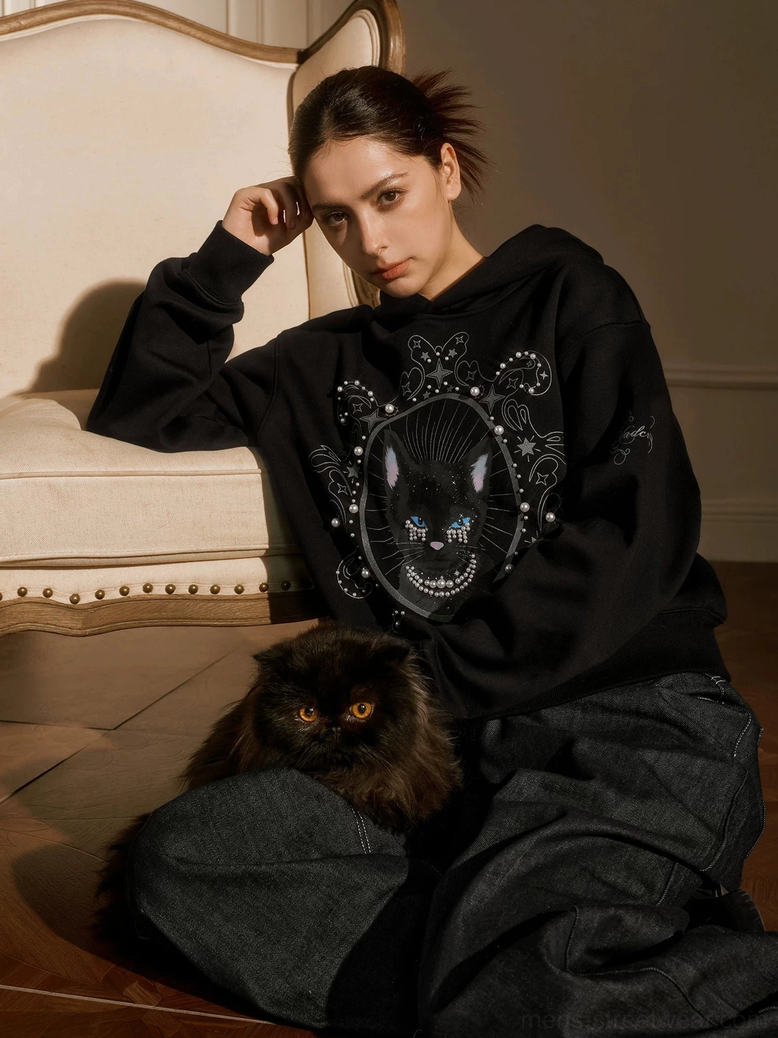 Black pearl embellished mystic cat graphic hoodie oversized fit styled on female model with black cat