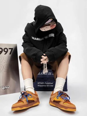 Perforated dual-lace platform sneakers styled with black hoodie brown shorts and white crew socks
