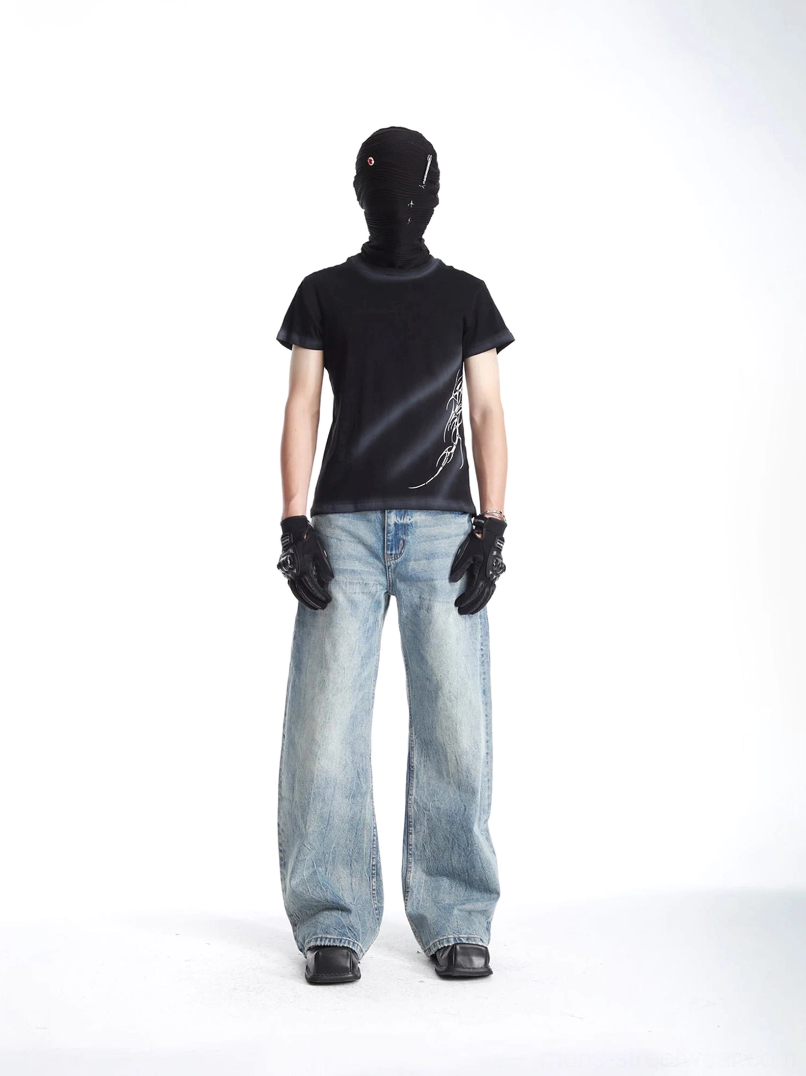 Black Phantom Arc graphic streetwear T-shirt front view with lower side tribal artwork, faded crew neck, and modern slim silhouette
