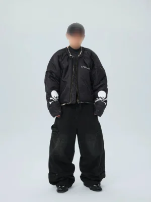 Front view of black phantom skull cropped puffer bomber jacket with white skull sleeve graphics and oversized streetwear fit