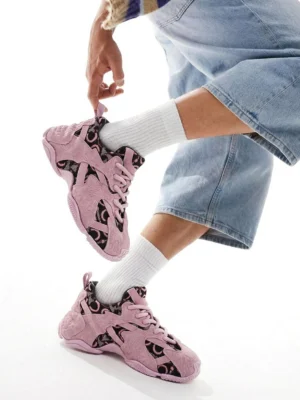 Pink chunky dad sneakers worn with white crew socks and cropped light blue denim in a Korean streetwear on-foot styling view