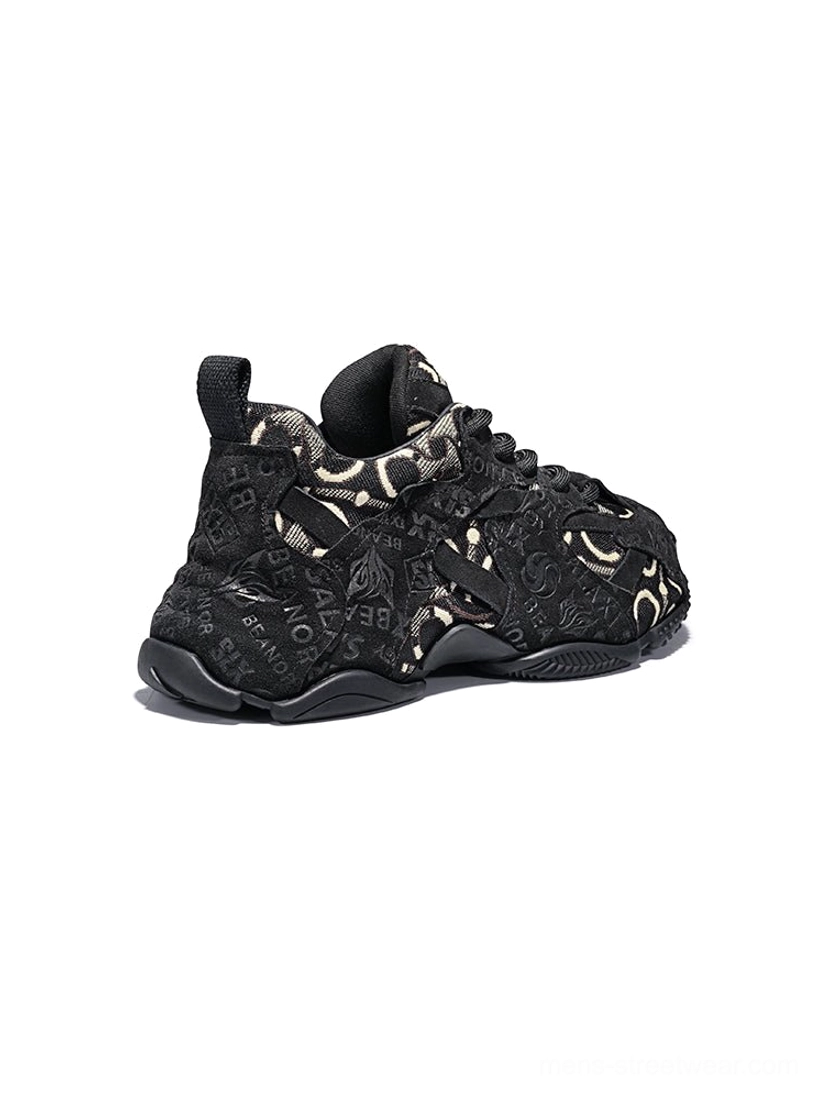 Pink Korean-style chunky sneakers featuring dusty pink overlays, monogram-inspired textile panels, lace-up closure, and sculpted rubber outsole