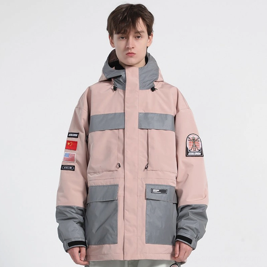 Pink unisex reflective ski jacket full front view with gray color block hood, cargo pocket design and streetwear sleeve patches