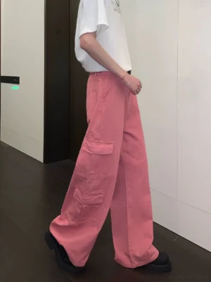 Left rear view of pink wide-leg cargo pants showing the side cargo pocket and flowing full-length wide-leg silhouette
