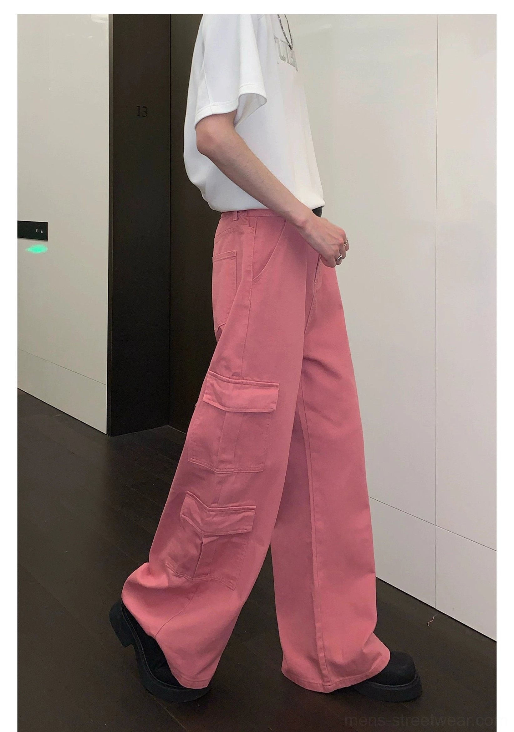 Pink utility cargo trousers with wide-leg fit, statement color, multiple pockets, and Korean-inspired streetwear styling