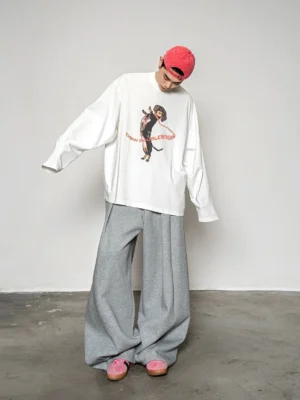 Full body view of a white oversized dachshund graphic long sleeve T-shirt styled as Korean streetwear with black dog artwork and red typography