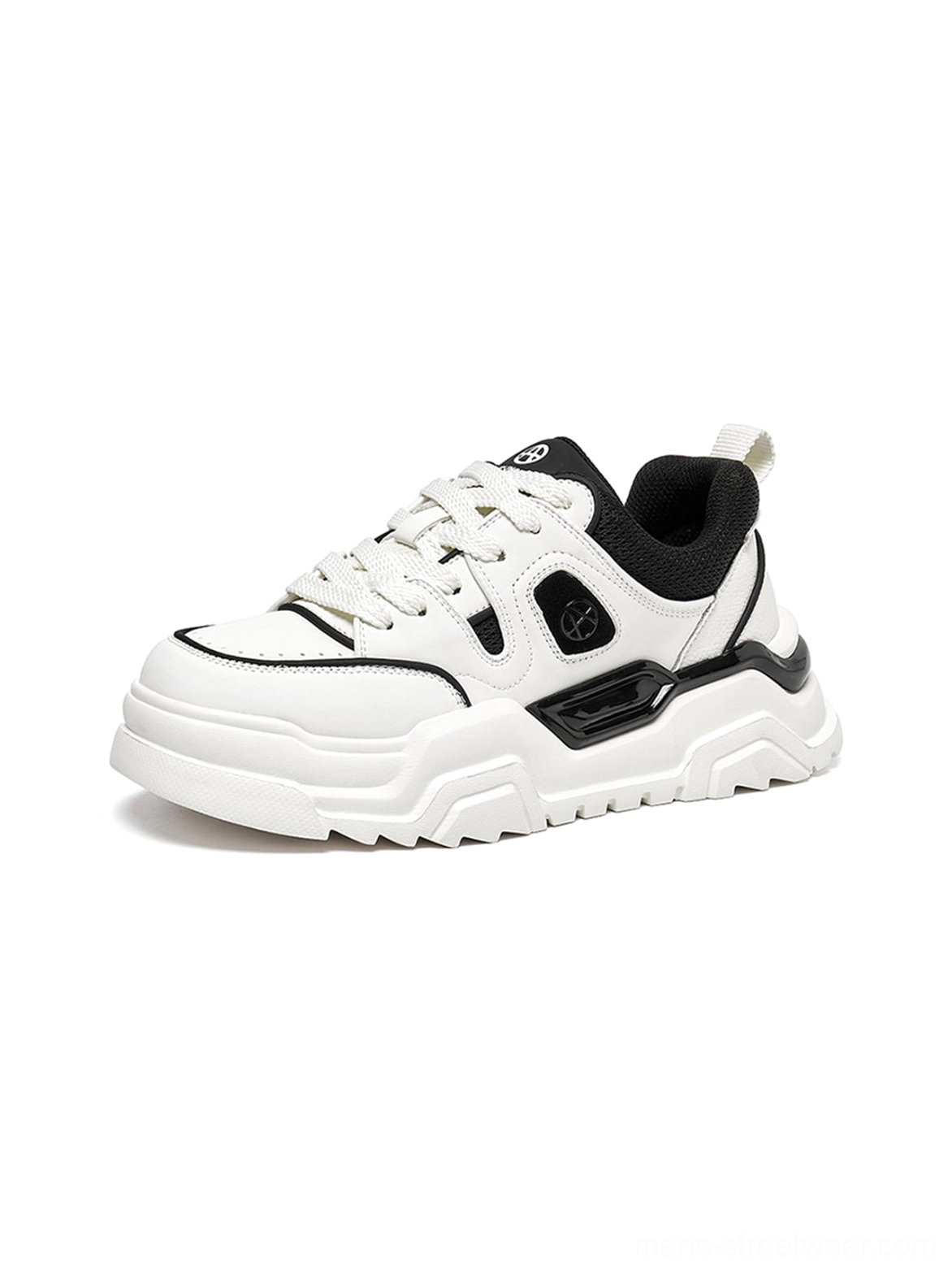 Black and white monochromatic platform sneaker bottom sole view showing deep lug tread pattern and technical traction design