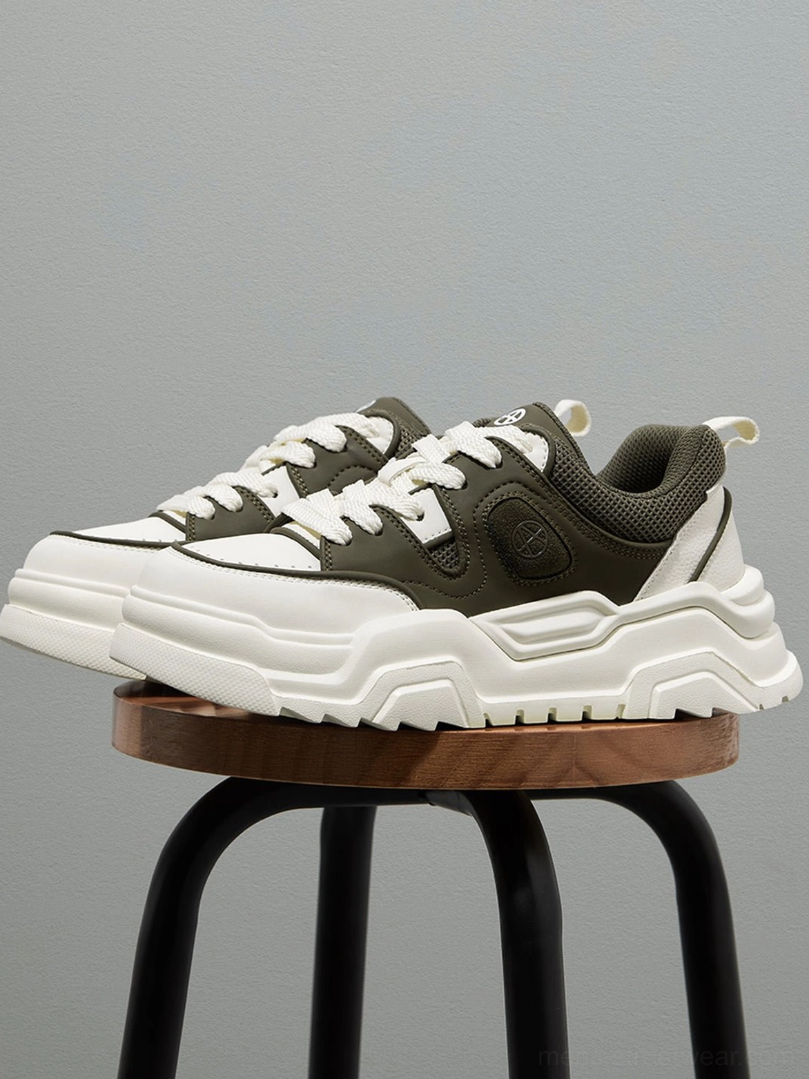 Khaki and black platform sneaker color comparison display showing neutral versus high-contrast aesthetic design options available
