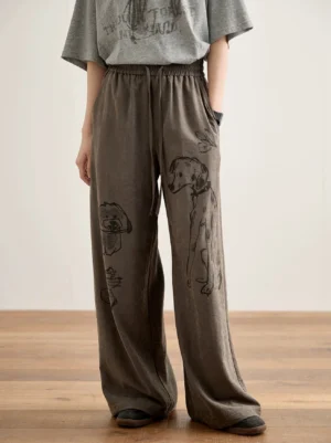 Black and gray playful pup doodle print wide-leg lounge pants styled with a gray short sleeve t-shirt