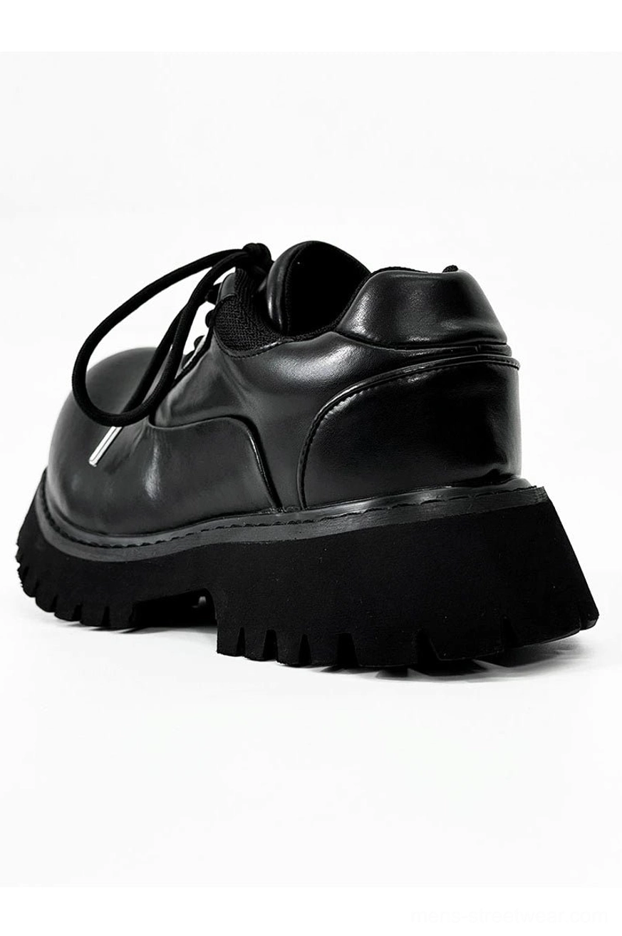 Polished black lace-up Derby shoes with rounded toe and elevated chunky rubber sole