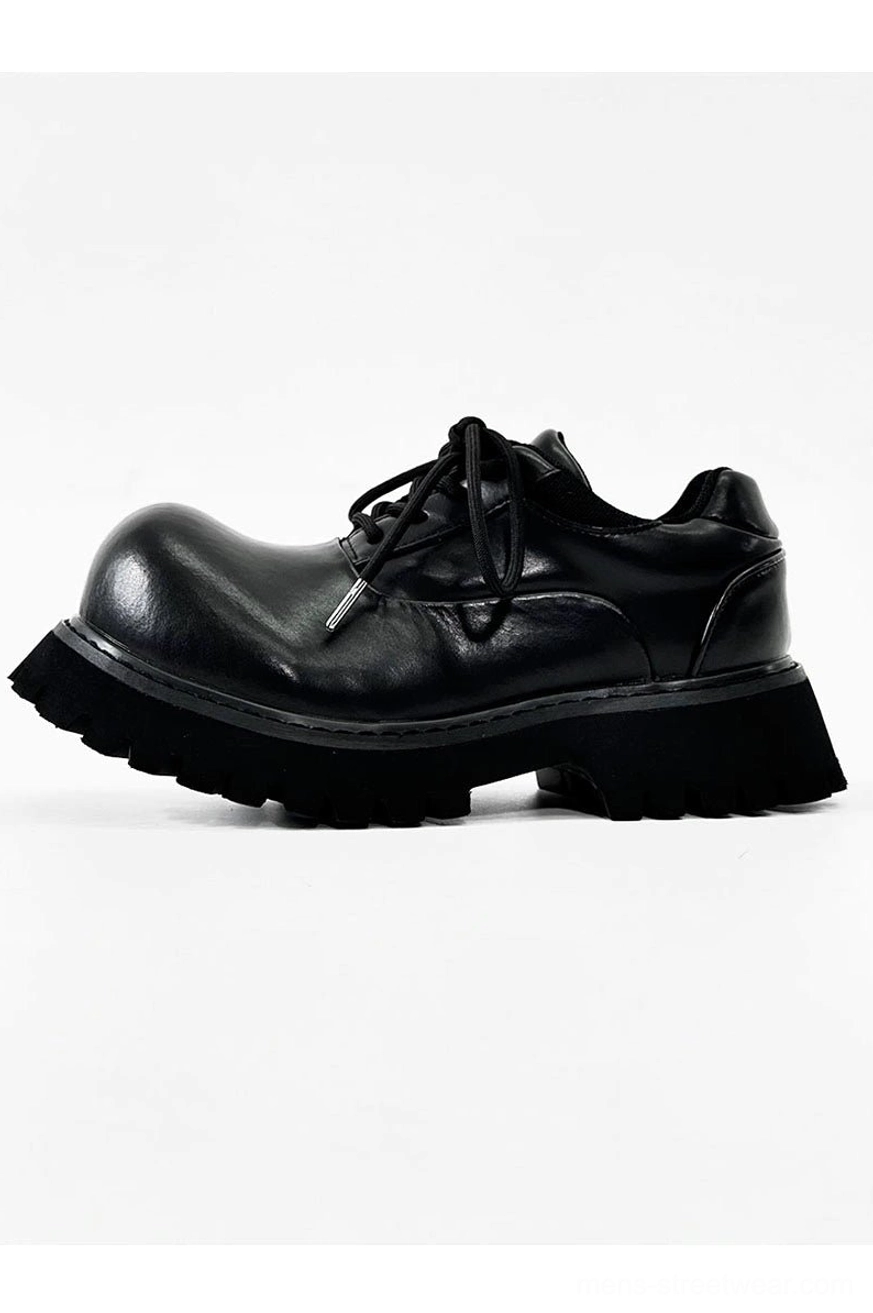 Polished black platform Derby shoes with chunky lug sole in a detailed product view