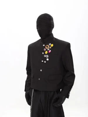 Front view of black punk scholar cropped stand-collar blazer and wide-leg pants suit with colorful chest badges